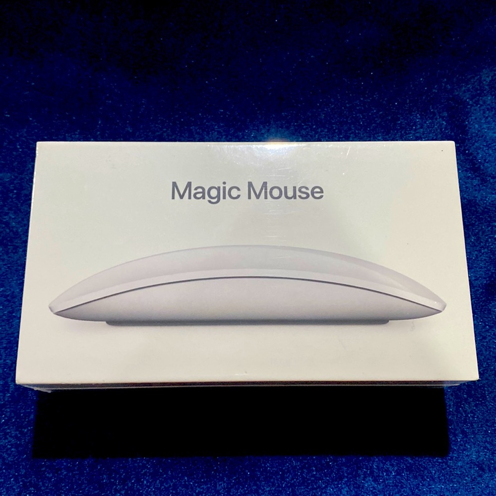 Magic Mouse. Brand new. Never opened. White in color.